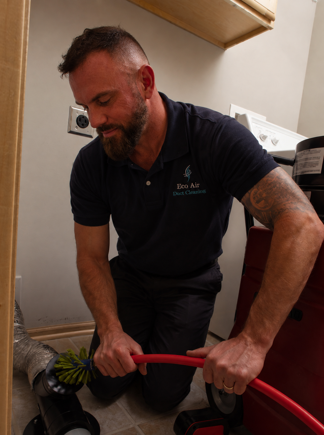 Professional Dryer Vent Cleaning in New Jersey Dryer vent cleaning technician servicing a dryer vent in New Jersey